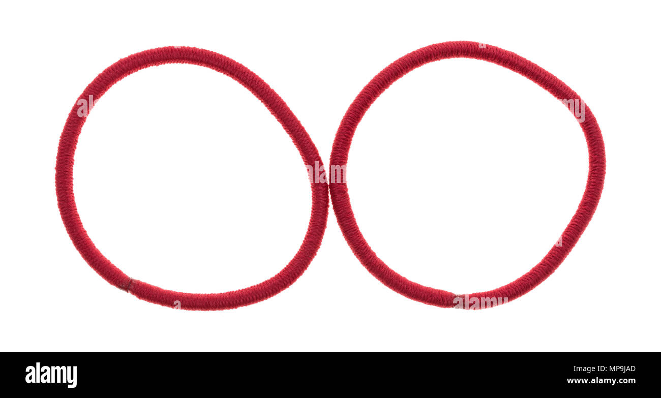 Top view of two red elastic ponytail ties on a white background. Stock Photo