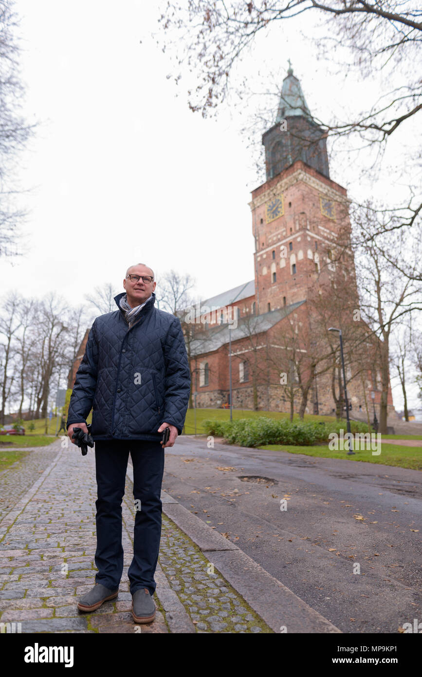 Mature handsome man enjoying life around the city of turku finl stock