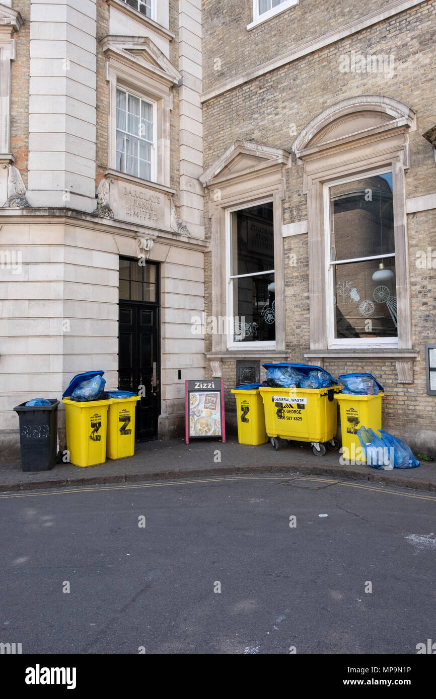 Rubbish bins outside the Zizzi restaurant in Cambridge city centre, UK