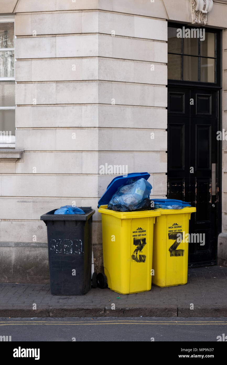 Rubbish bins outside the Zizzi restaurant in Cambridge city centre, UK