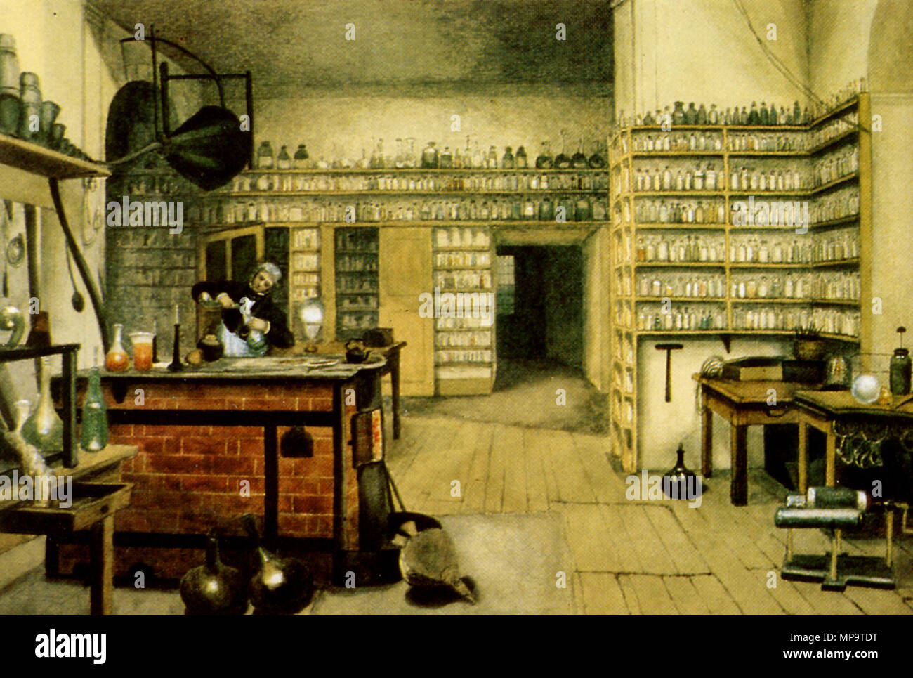 . Michael Faraday in his laboratory at the Royal Institution. From a painting by Harriet Moore. Azərbaycanca: Maykl Faradey öz laboratoriyasında, Harriyet Mur tərəfindən Deutsch: Michael Faraday in seinem Labor, von Harriet Moore English: Michael Faraday in his lab, by Harriet Moore Español: Michael Faraday en su laboratorio, por Harriet Moore Français : Michael Faraday dans son laboratoire, par Harriet Moore Polski: Michael Faraday w jego laboratorium, autorstwa Harriet Moore . 19th century. Harriet Jane Moore (1801-1884) 837 M Faraday Lab H Moore Stock Photo