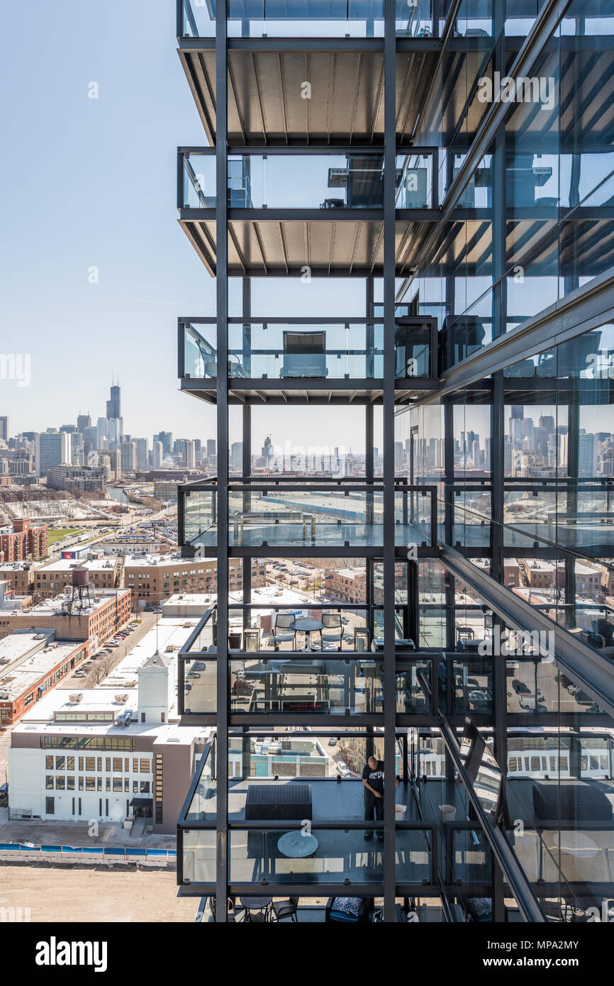 Balconies of modern apartment building overlooking the Chicago skyline. Stock Photo