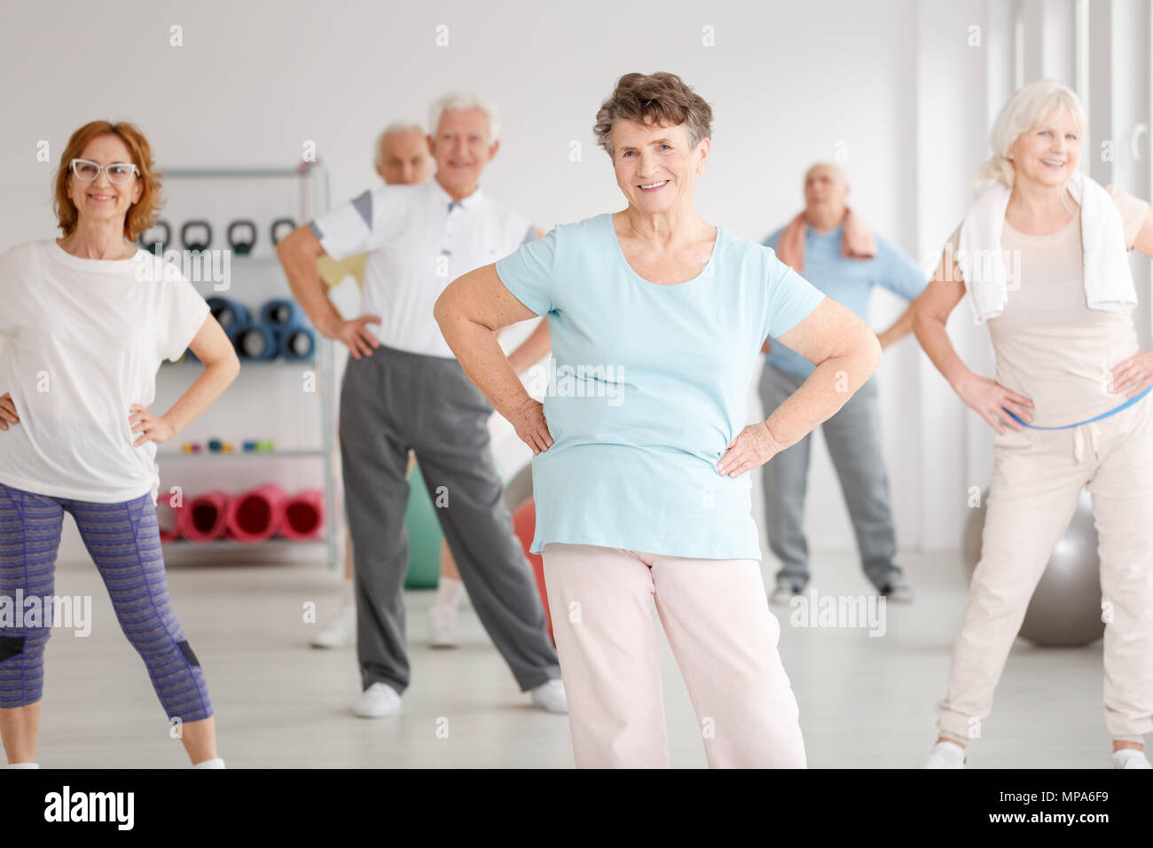 Group of active seniors exercising in fitness club Stock Photo