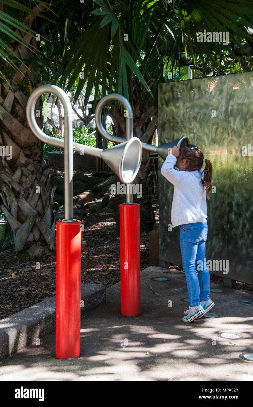 Child talking on a playground 'speaker phone' at South Bank, Brisbane, Queensland, Australia Stock Photo