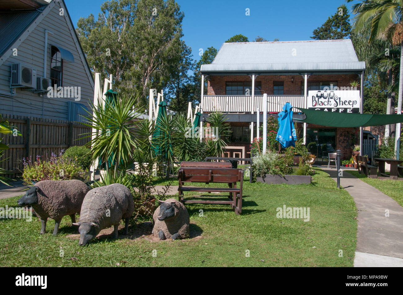 Life-sized sheep replicas draw daytrippers to a local business in Samford, a hill country village outside Brisbane, Queensland, Australia Stock Photo