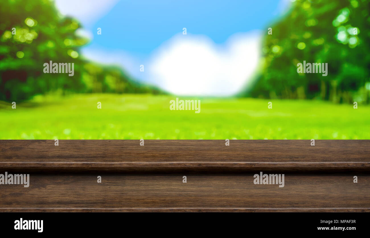 Empty Step Wood Table Top With Blur Tree In Park With Bokeh Light