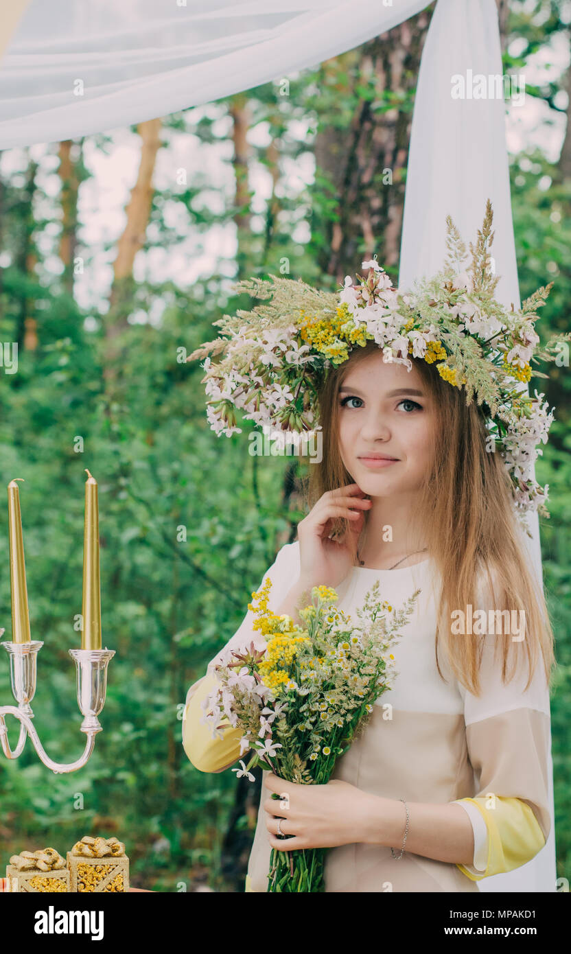 Beautiful woman with a wreath on her head from real flowers Stock Photo ...