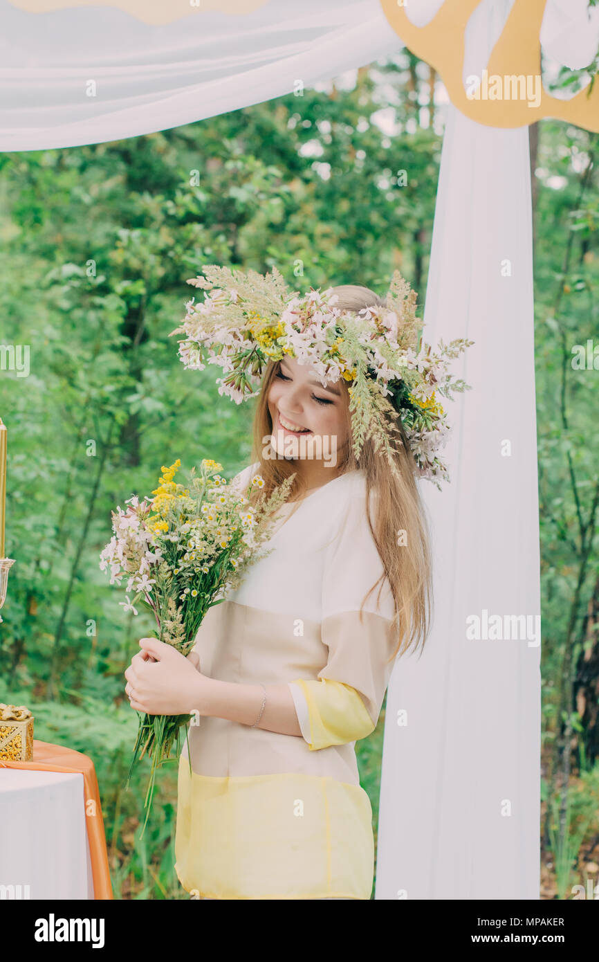 Beautiful woman with a wreath on her head from real flowers Stock Photo ...