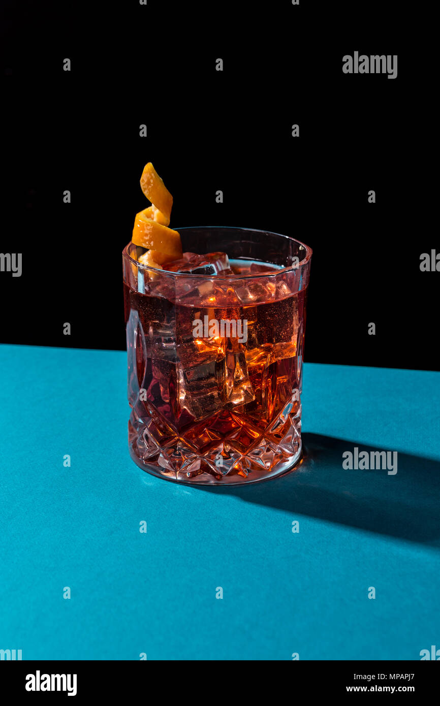 Negroni IBA cocktail, with gin, bitter, vermut, in pop contemporary