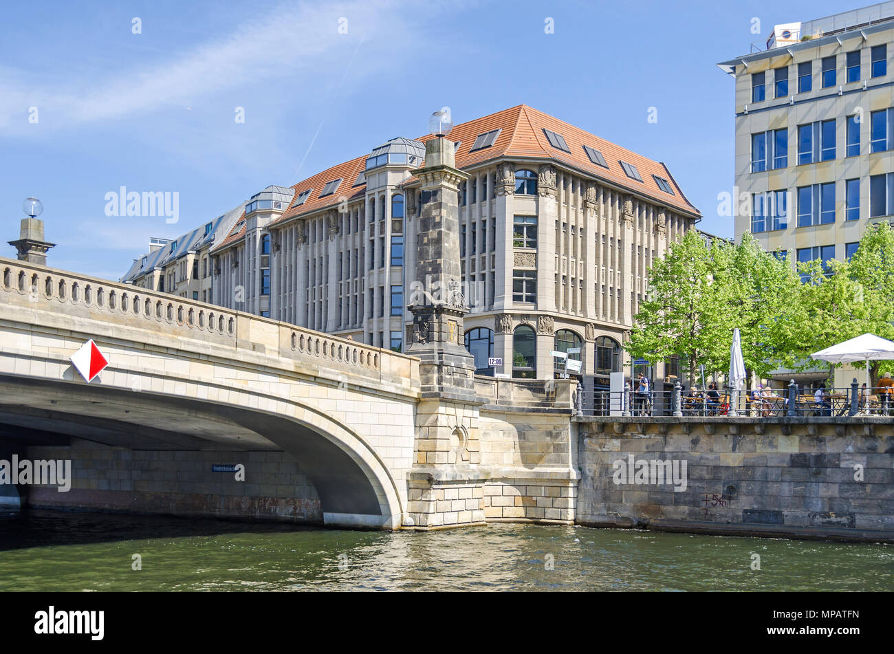 Berlin, Germany - April 22, 2018: Eastern shore of the river Spree Spreeufer with the building of the theological faculty of the Humboldt University,  Stock Photo