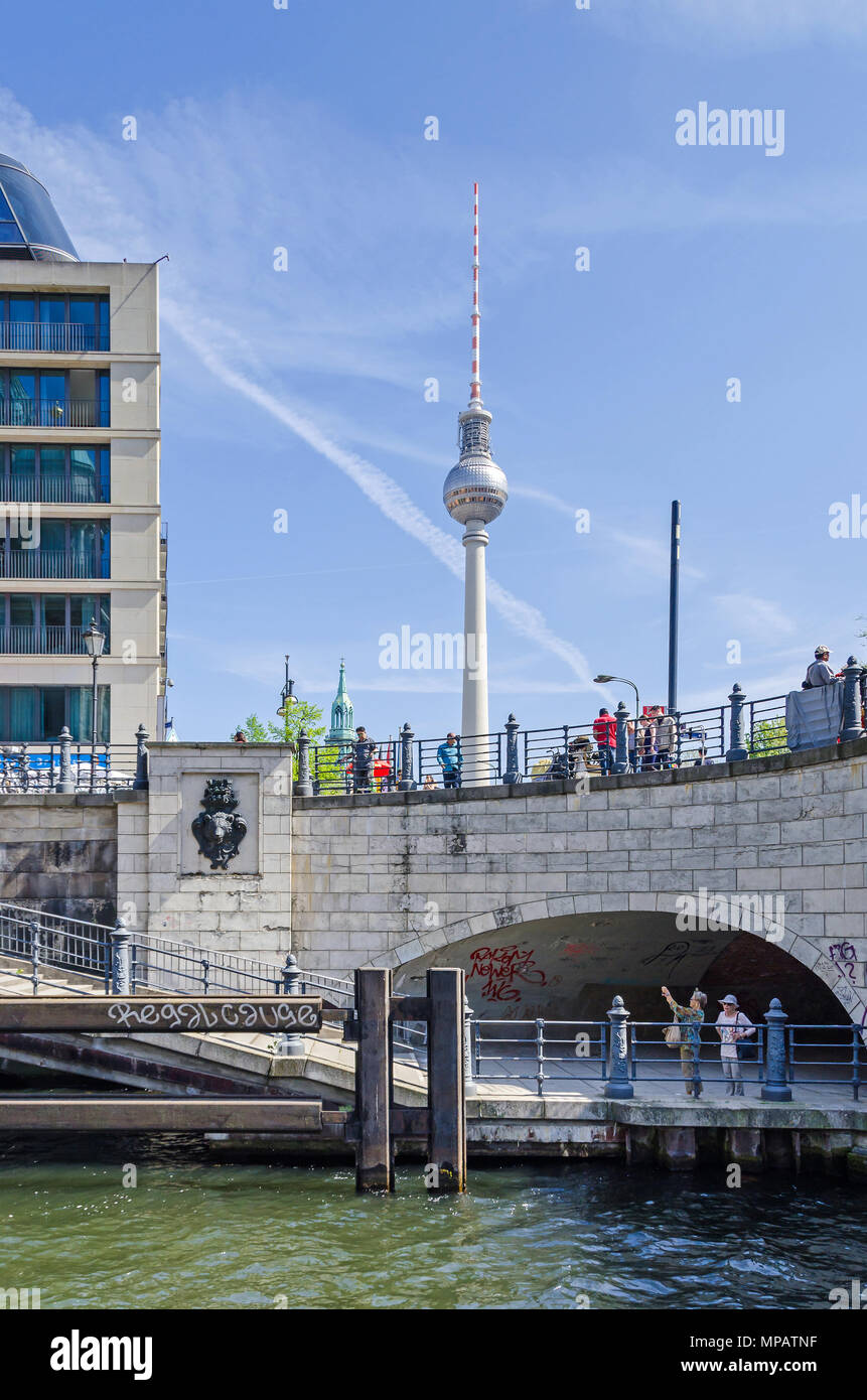 Berlin, Germany - April 22, 2018: View from the river Spree at its eastern shore, the Liebknecht bridge with its hystorical bear head and the televisi Stock Photo