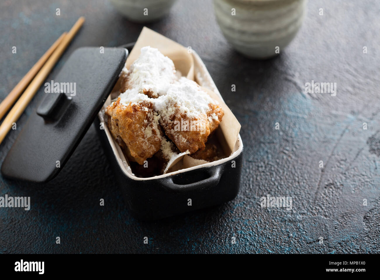 Asian style fried donuts with powdered sugar Stock Photo Alamy