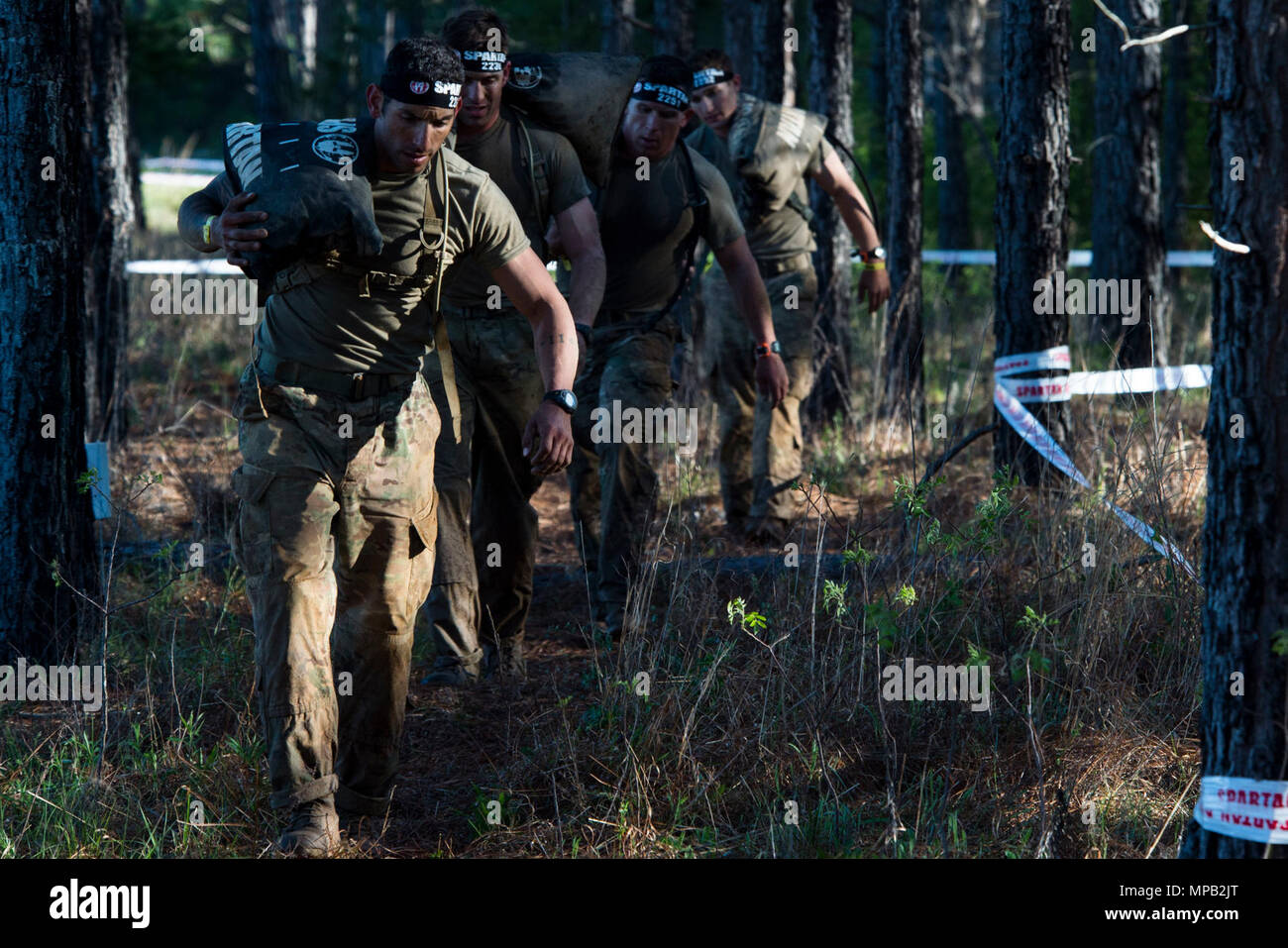 U.S Army Rangers carry a sand bang in a Spartan Race during the Best