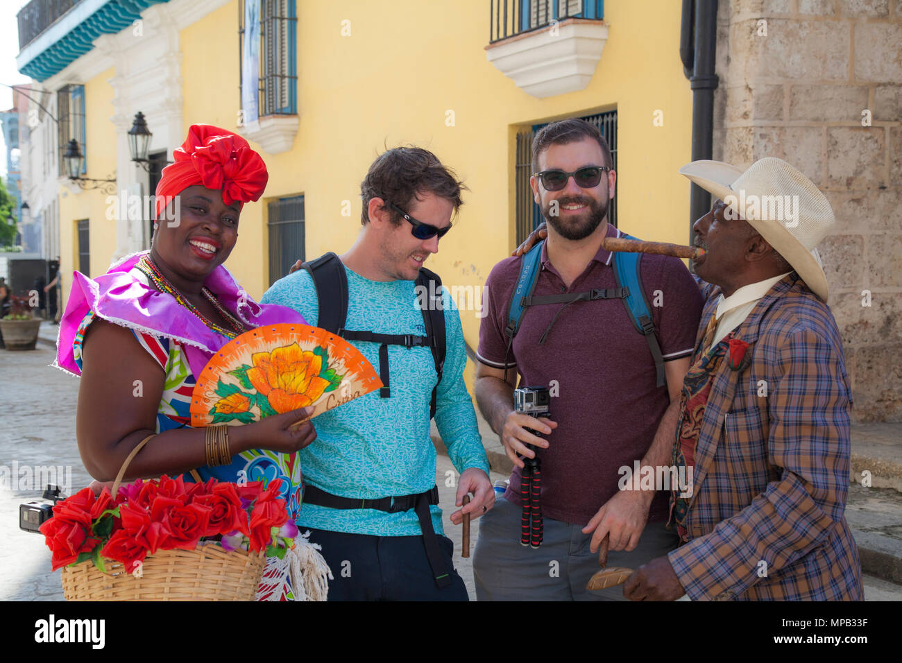 Tourists having fun with local cubans in Old Havana Cuba Stock Photo ...