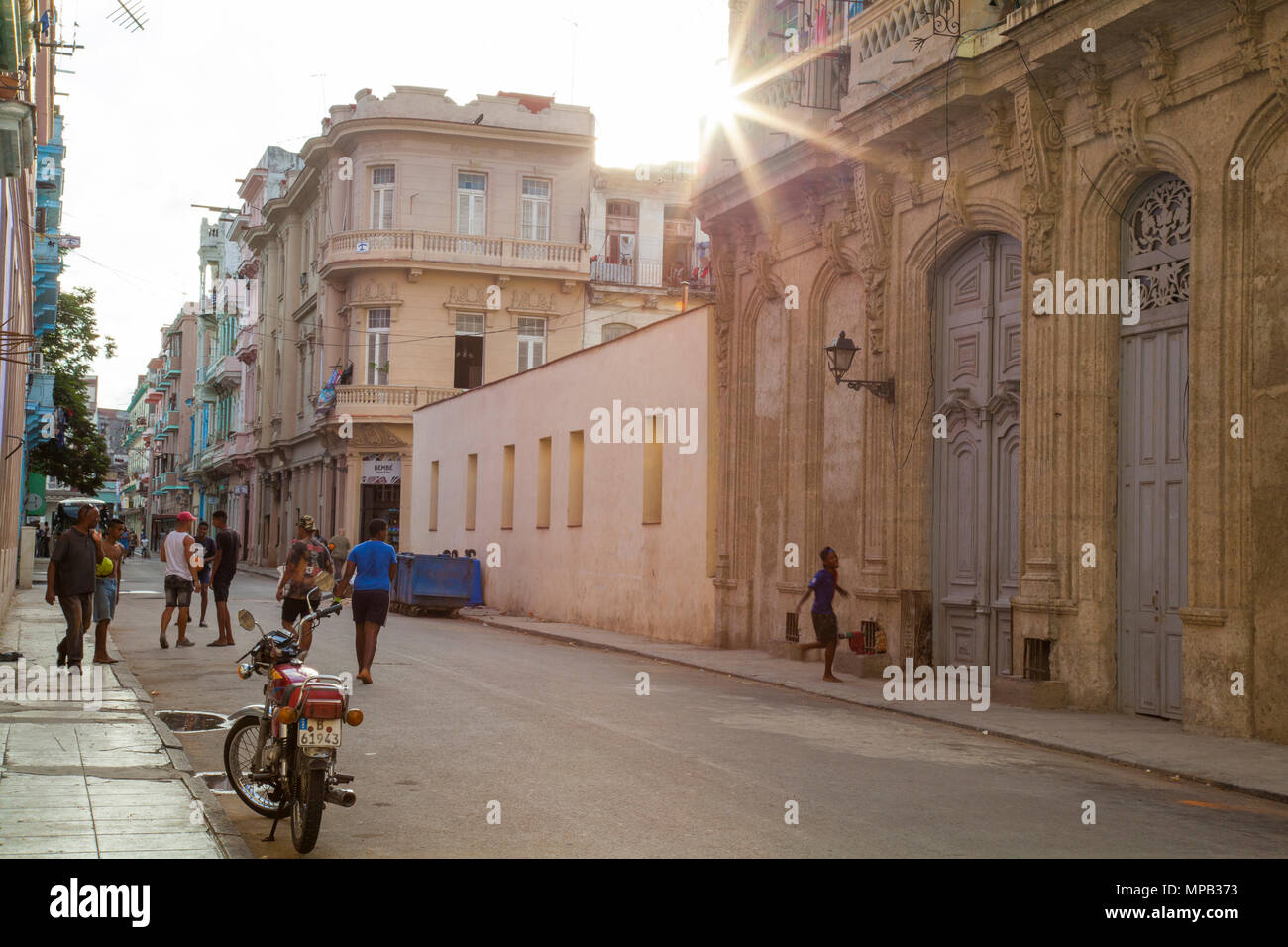 Local cuban children playing soccer and basketball in the streets of ...