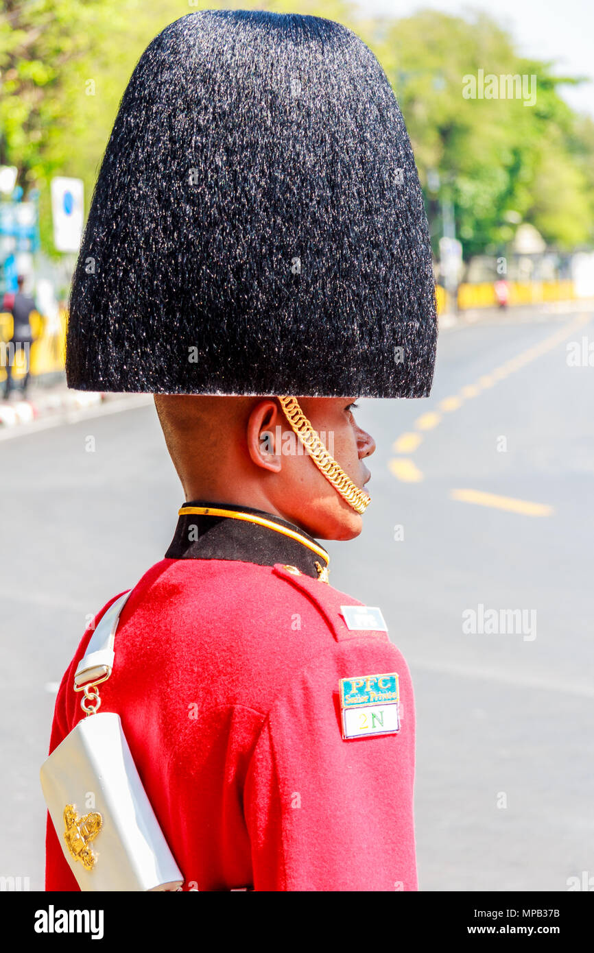 Thai soldier in uniform wearing a busby hat, Bangkok, Thailand Stock Photo