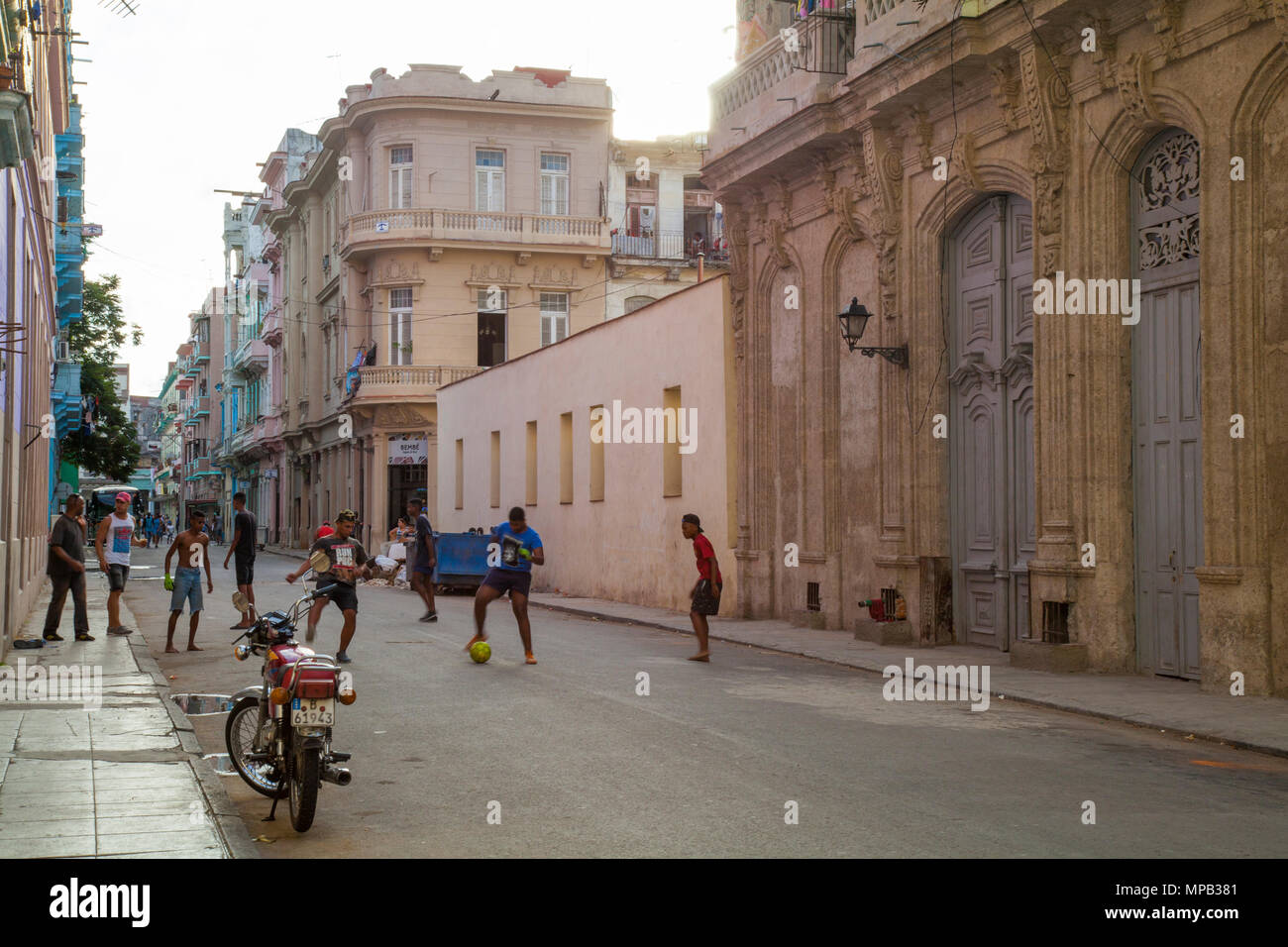 Local cuban children playing soccer and basketball in the streets of ...