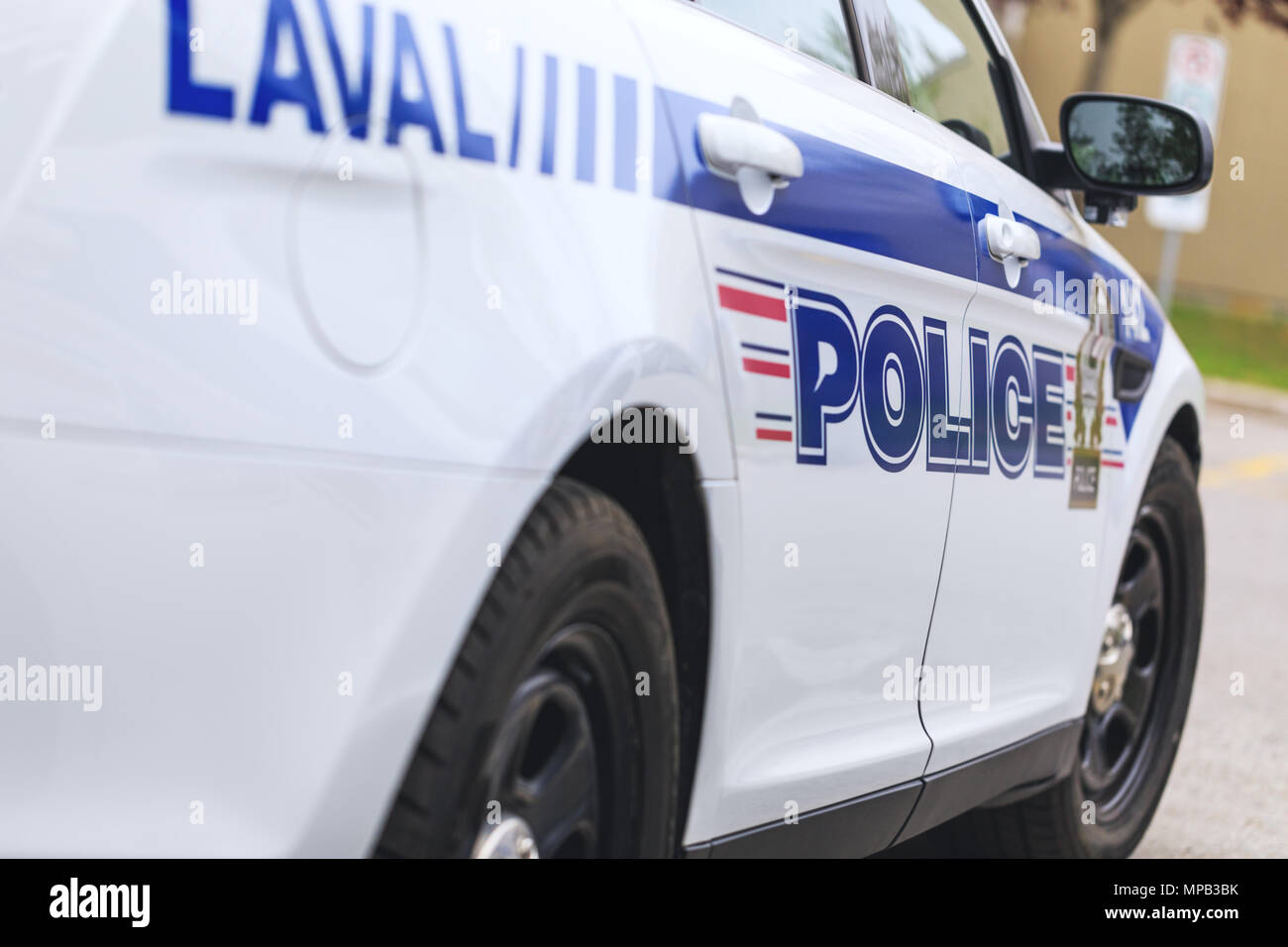 Laval, Canada: May 19, 2018. A real police car of the municipal police department in Laval town, during intervention. Inscriptions on the car. Stock Photo