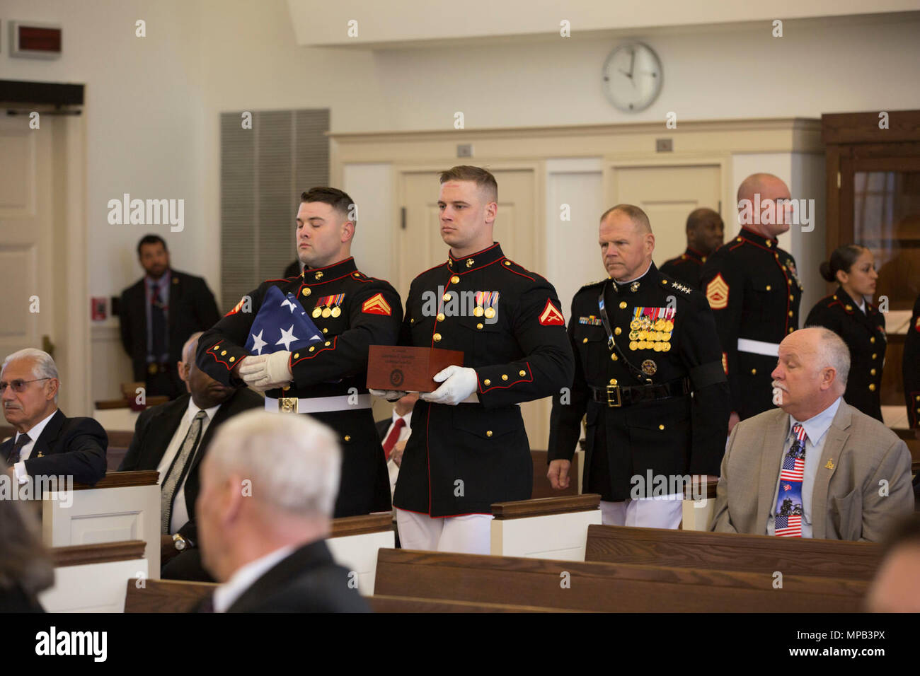 U.S. Marines with Marine Barracks Washington carry the remains of retired U.S. Marine Corps Lt. Gen. Lawrence F. Snowden during his Memorial Service at the U.S. Marine Memorial Chapel, Quantico, Va., April 8, 2017. Snowden retired in 1979 after nearly 40 years of service, fought in engagements during World War II, the Korean War, and Vietnam. He passed away Feb. 18, 2017. He was prominently known after retirement for organizing joint 'Reunion of Honor' missions which is an opportunity for Japanese and U.S. veterans and their families, dignitaries, leaders and service members from both nations  Stock Photo