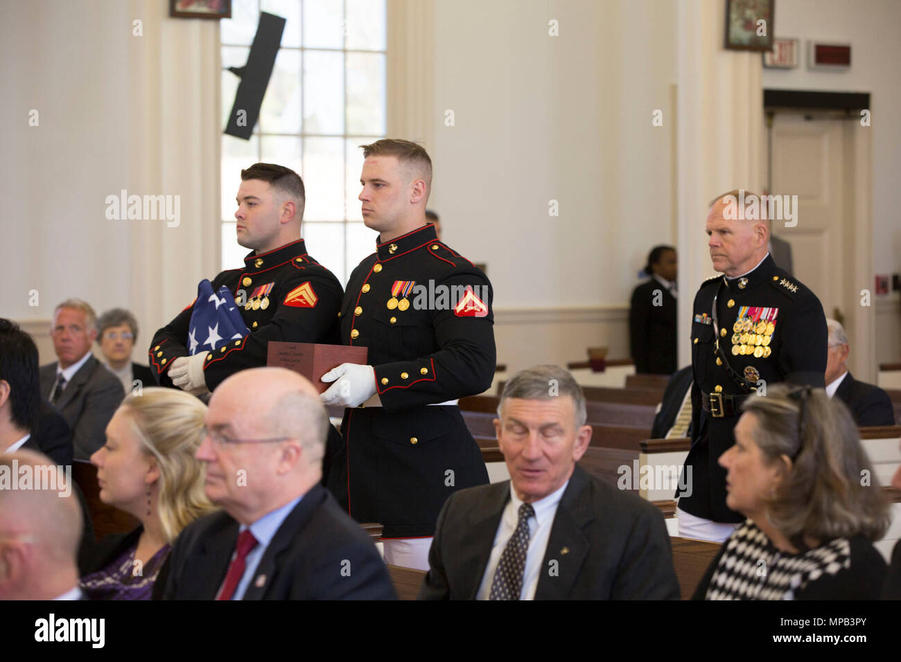 U.S. Marines with Marine Barracks Washington carry the remains of retired U.S. Marine Corps Lt. Gen. Lawrence F. Snowden during his Memorial Service at the U.S. Marine Memorial Chapel, Quantico, Va., April 8, 2017. Snowden retired in 1979 after nearly 40 years of service, fought in engagements during World War II, the Korean War, and Vietnam. He passed away Feb. 18, 2017. He was prominently known after retirement for organizing joint 'Reunion of Honor' missions which is an opportunity for Japanese and U.S. veterans and their families, dignitaries, leaders and service members from both nations  Stock Photo
