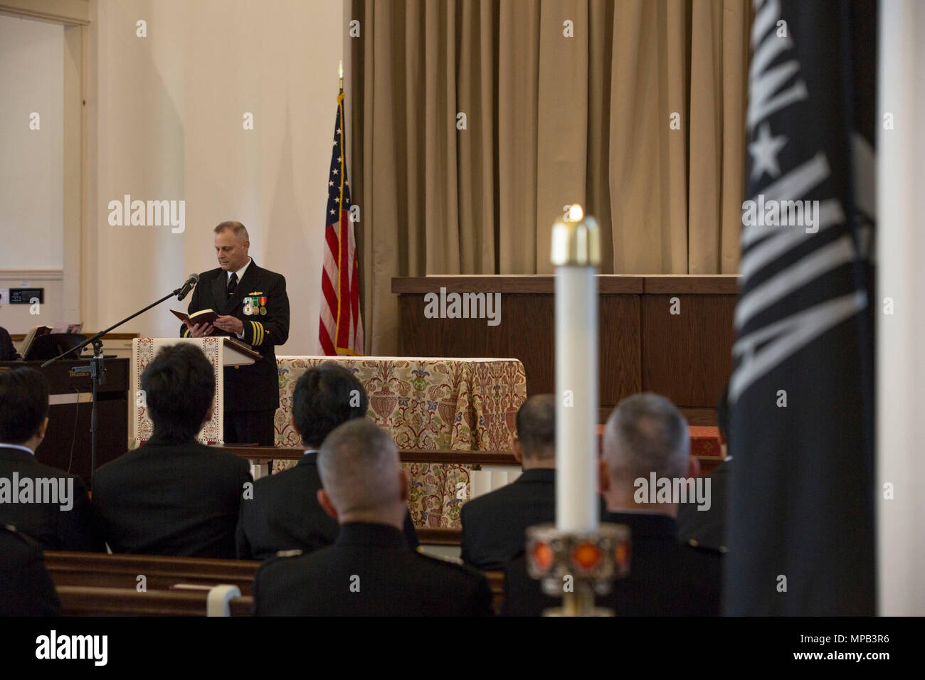 Chaplain Robert Etheridge, deputy command chaplain, Marine Corps Base Quantico, reads scripture during the memorial service of retired U.S. Marine Corps Lt. Gen. Lawrence F. Snowden at the U.S. Marine Memorial Chapel, Quantico, Va., April 8, 2017. Snowden retired in 1979 after nearly 40 years of service, fought in engagements during World War II, the Korean War, and Vietnam. He passed away Feb. 18, 2017. He was prominently known after retirement for organizing joint 'Reunion of Honor' missions which is an opportunity for Japanese and U.S. veterans and their families, dignitaries, leaders and s Stock Photo