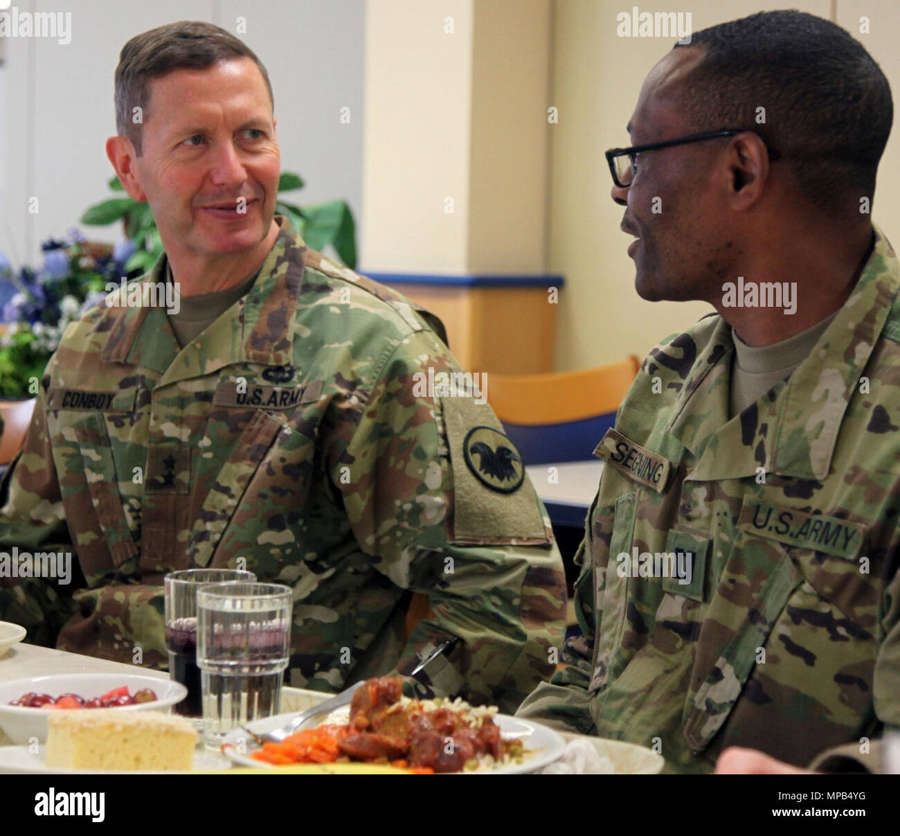 KAISERSLAUTERN, Germany – Maj. Gen. David Conboy, deputy commanding general  - operations, United States Army Reserve Command, speaks with Capt. Jean  Segning, logistics officer, 7th Mission Support Command, April 8 at the