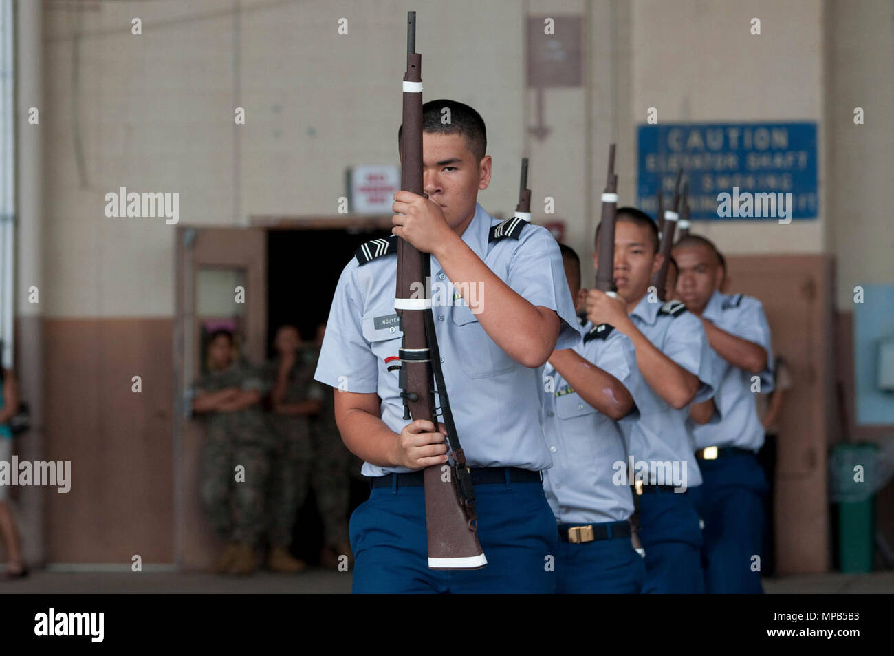 KAPOLEI — McKinley High School JROTC Cadets compete in an armed drill routine of the Pacific Region JROTC Drill Championship at Hawaii Army National Guard’s Rainbow Hangar, April 8, 2017. Stock Photo