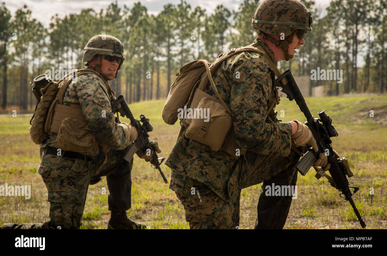U.S. Marines attached to Advanced Infantry Training Battalion, School of Infantry-East (SOI-E), prepare to fire their M4A1 carbine during a combined arms exercise at Camp Lejeune, N.C., April 7, 2017. The mission of SOI-E is to train entry-level and advanced level Marines in the skills required of an Infantry Marine for the operating forces. Stock Photo