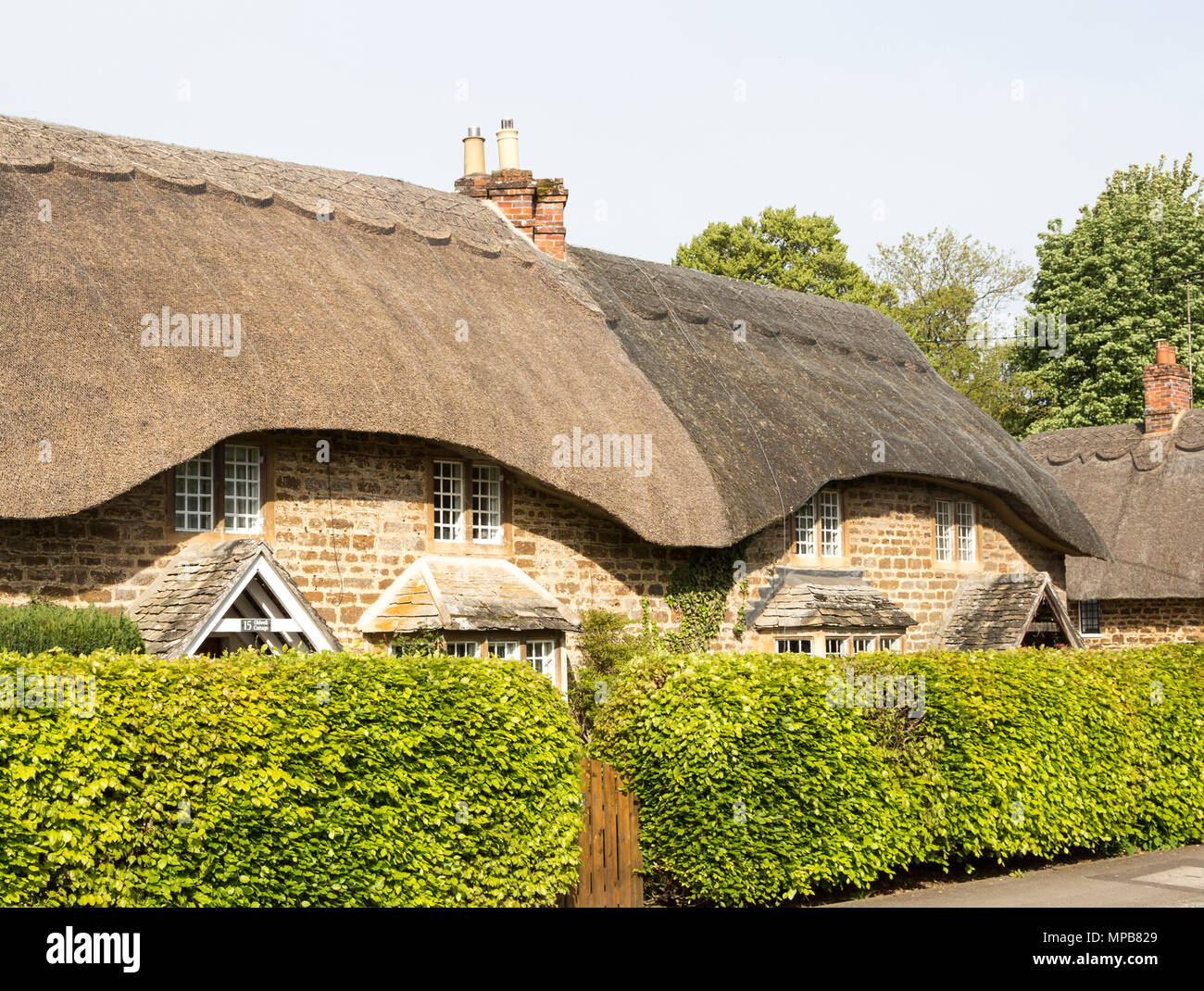 Historic thatched cottages at village of Sandy Lane, Wiltshire, England