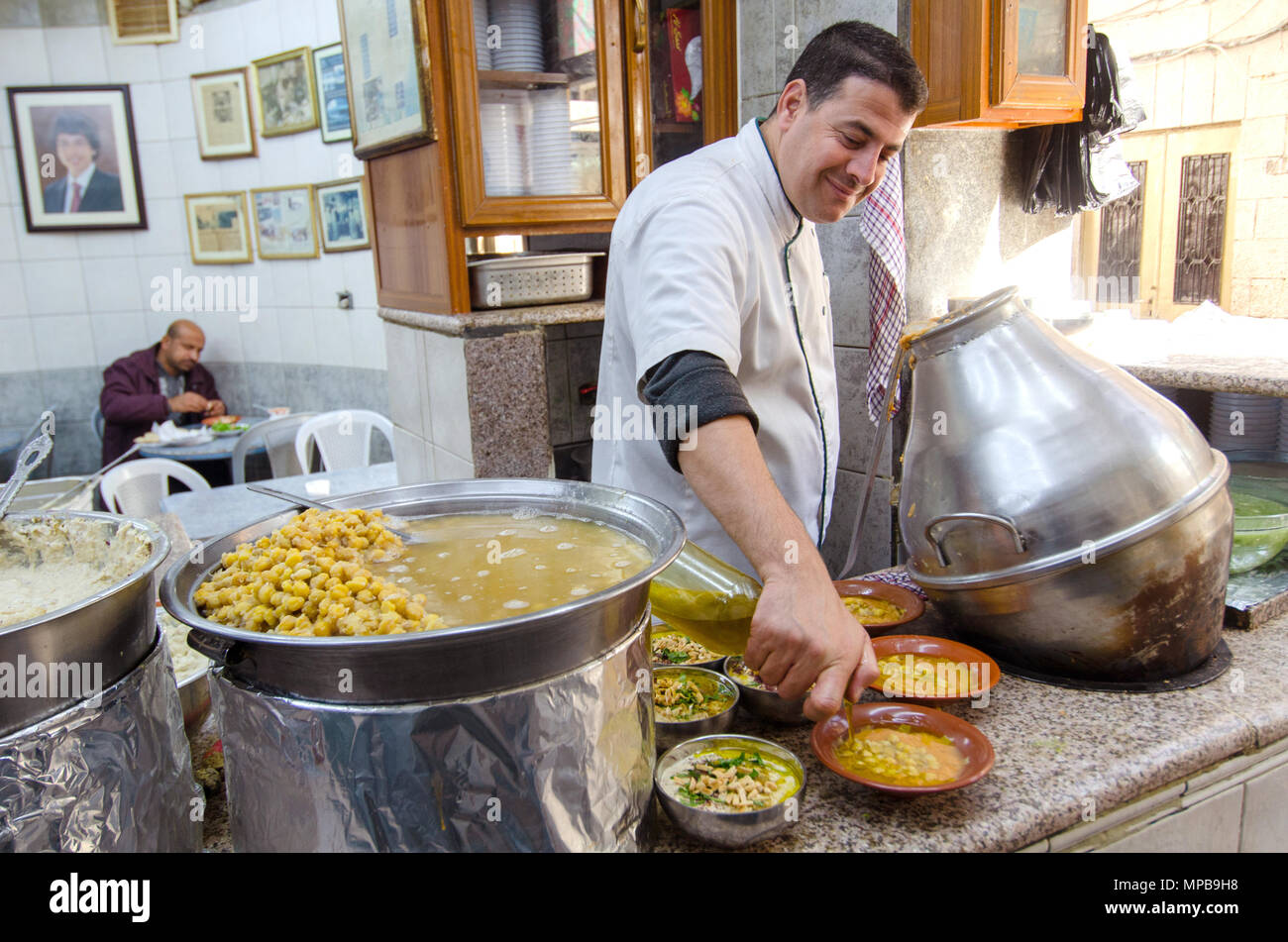 Hashem Restaurant, downtown Amman, Jordan. Fuul, Falafel and Hummus being  prepared at the legendary eatery Stock Photo - Alamy