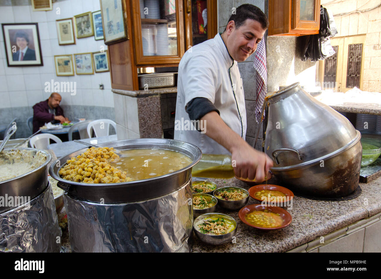 Hashem Restaurant, downtown Amman, Jordan. Fuul, Falafel and Hummus being prepared at the legendary eatery. Stock Photo
