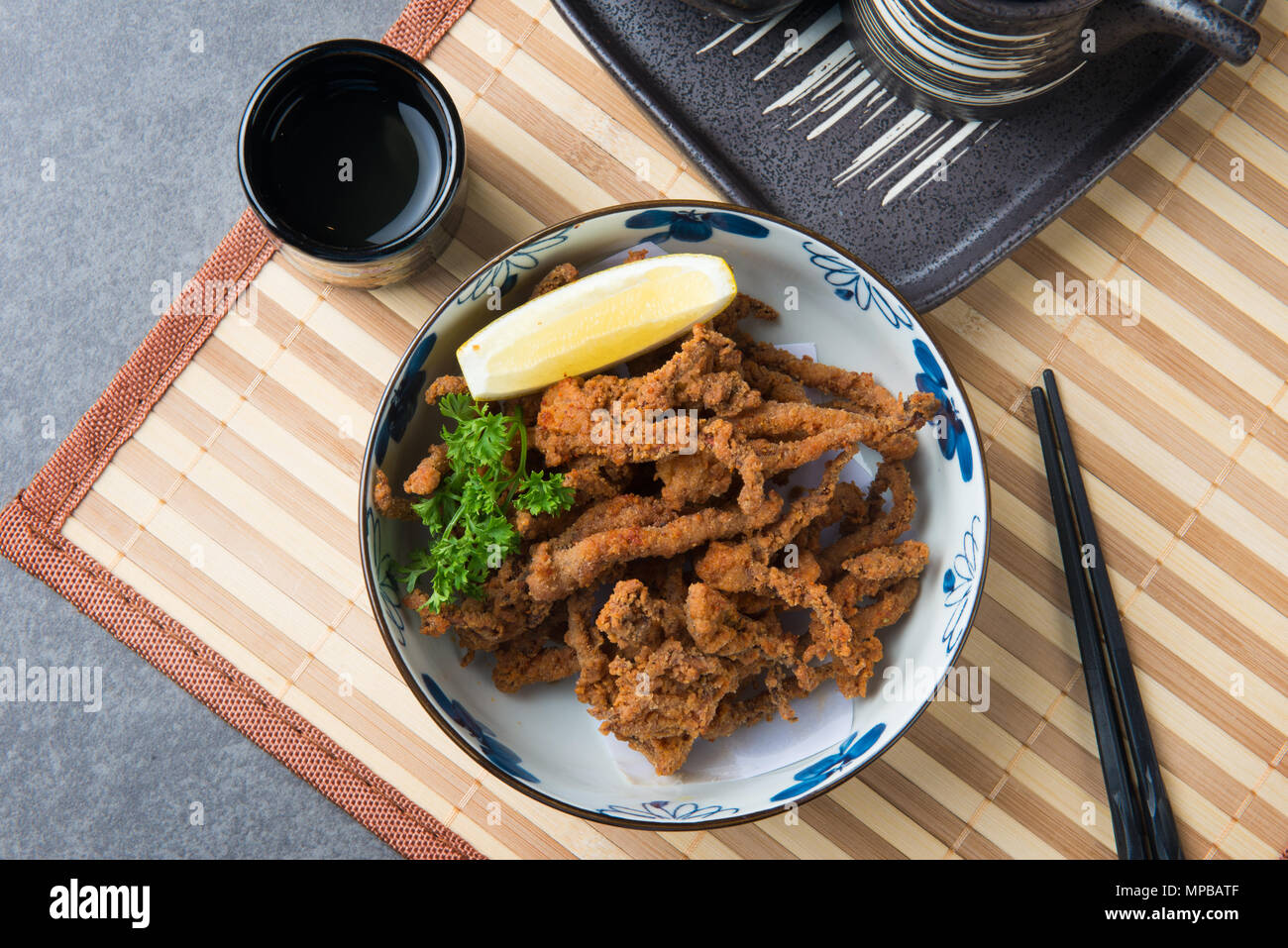 Ika Geso japanese fried spicy squid tentacle flat lay Stock Photo - Alamy