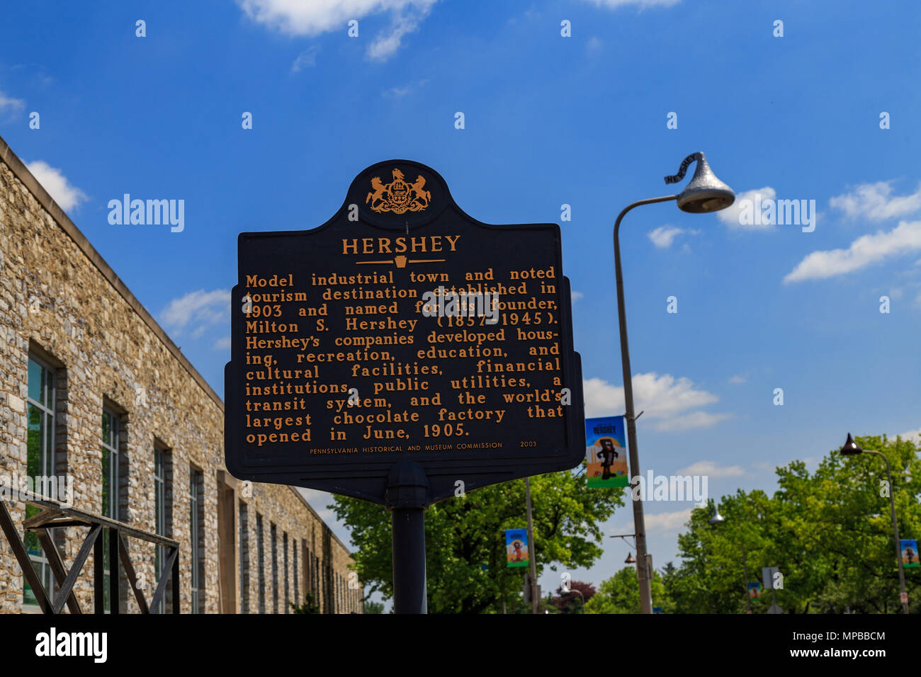 Hershey, PA, USA - May 21, 2018: An historical marker sign stands in front of the Hershey Chocolate Factory. Stock Photo