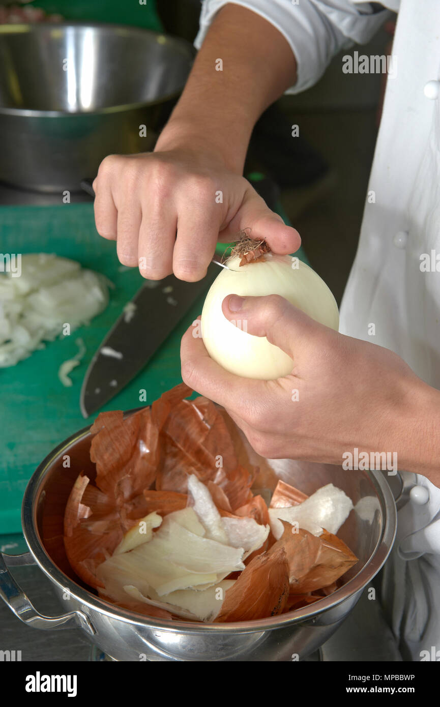 Chef cutting onion on table hi-res stock photography and images - Alamy
