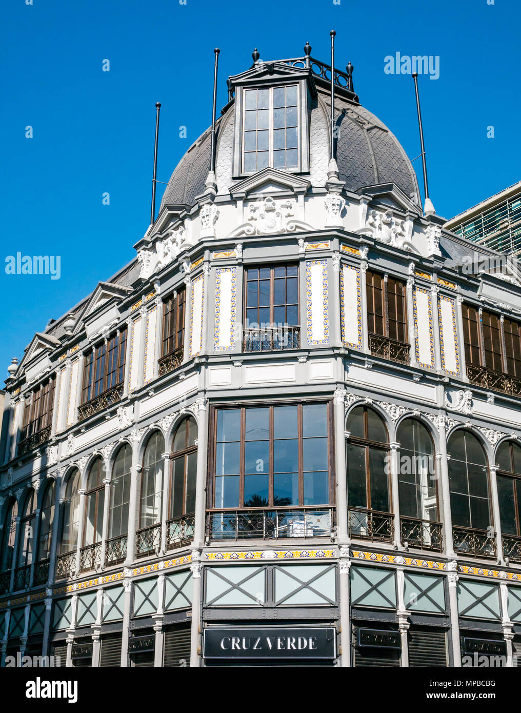 Cruz Verde pharmacy sign on historic old corner building with dome roof and arched windows, corner of Plaza de Armas, Santiago, Chile, South America Stock Photo