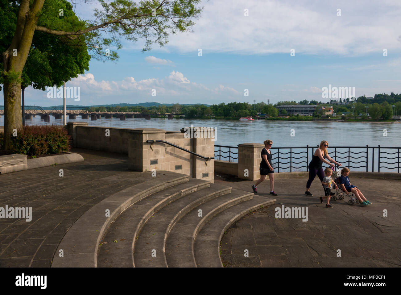 USA Pennsylvania PA Harrisburg state capitol people enjoying the riverfront walk on a summer evening along the Susquehanna River Stock Photo