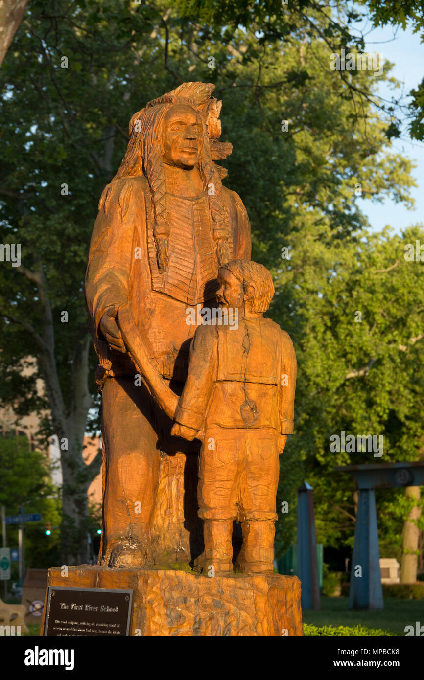 USA Pennsylvania PA Harrisburg Wood sculpture of a Susquehannock Native American and child along the Susquehanna River Stock Photo