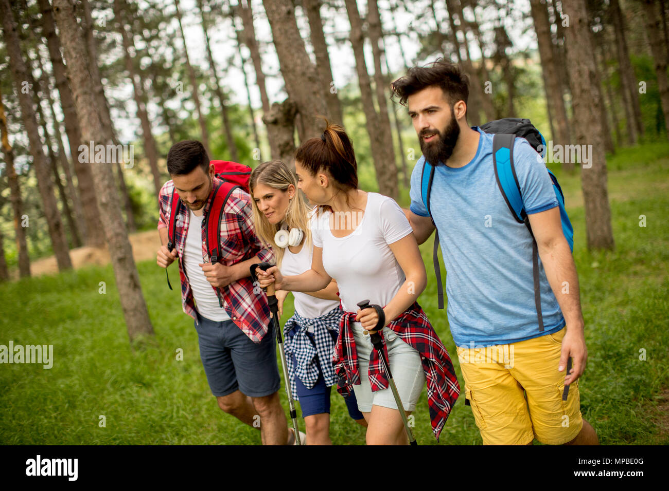 Group of young people are hiking in mountain at spring day Stock Photo ...
