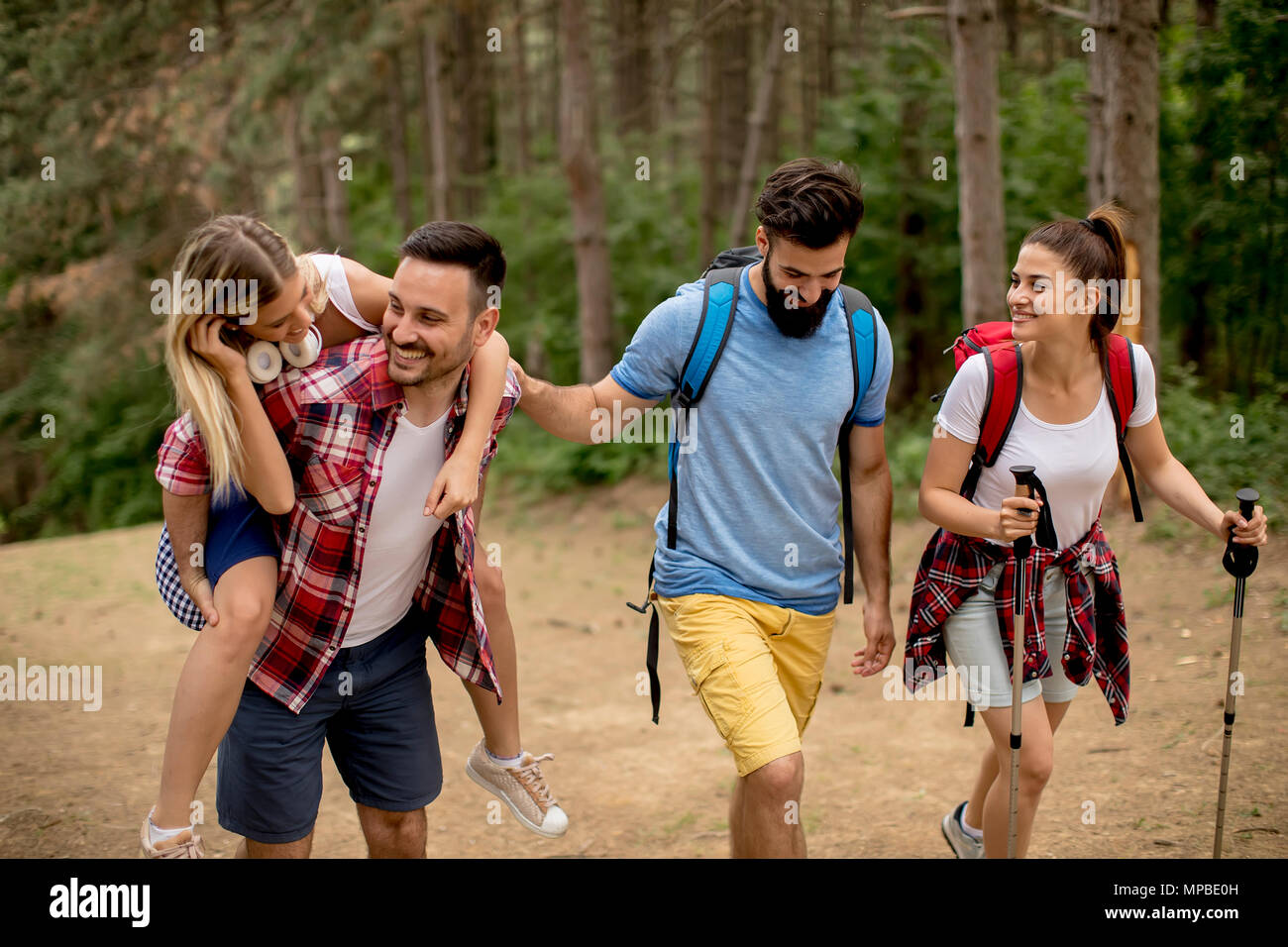 Group of young people are hiking in mountain at spring day Stock Photo ...