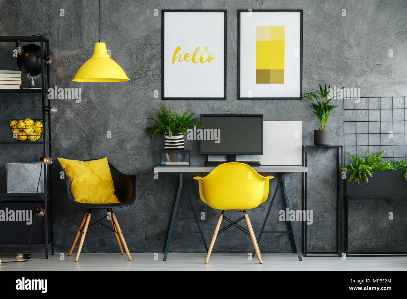 Office area in contemporary interior with yellow decor and modern