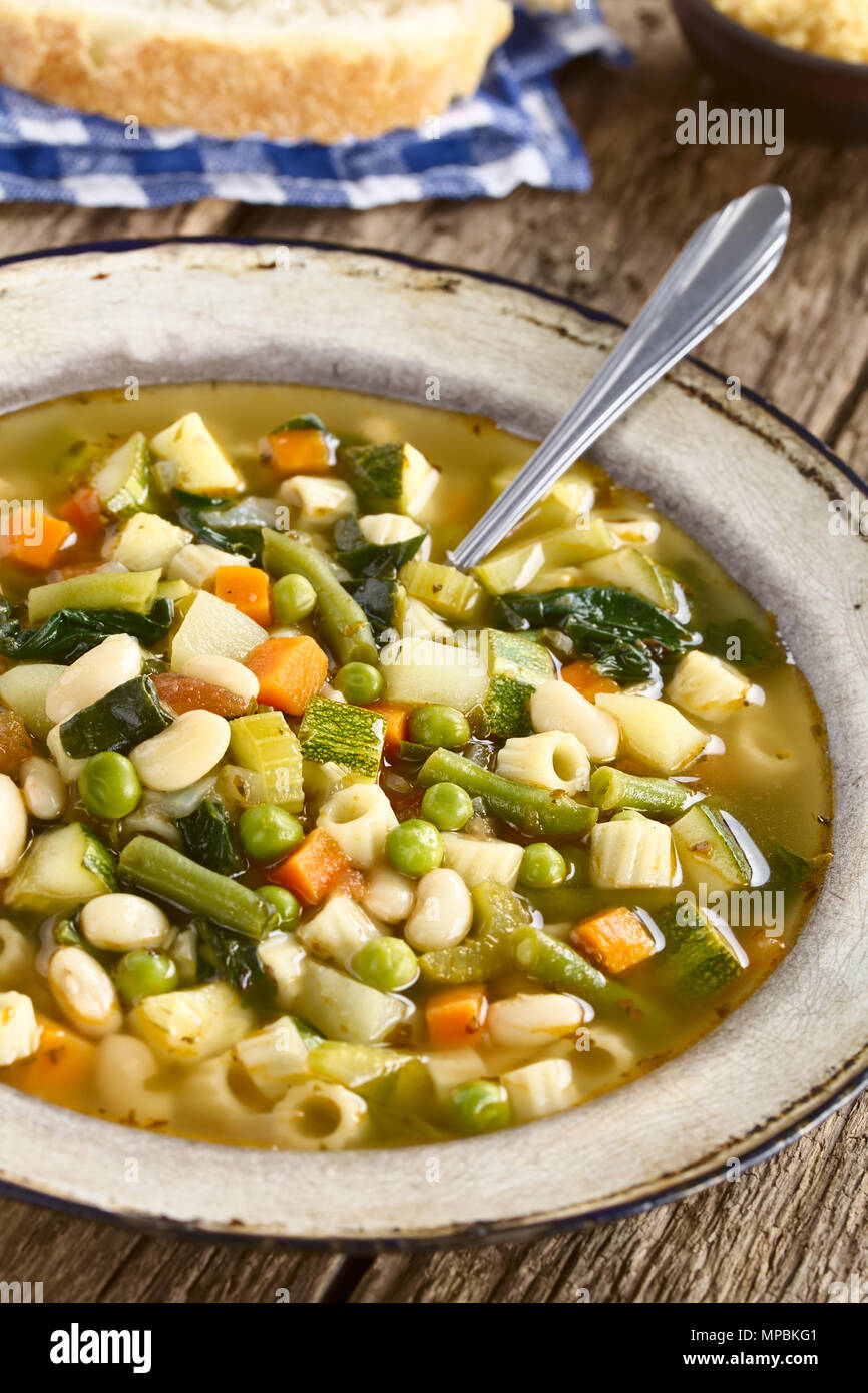 Fresh homemade vegetable soup made of zucchini, celery, carrot, peas
