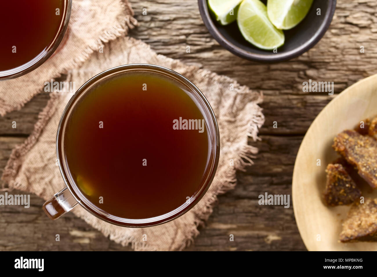 Fresh homemade Aguapanela, Agua de Panela or Aguadulce, a popular Latin American sweet drink made of panela unrefined whole cane sugar boiled in water Stock Photo