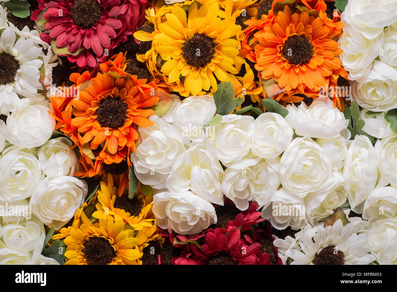 Reusable artificial flowers made from cloth and plastic. Stock Photo
