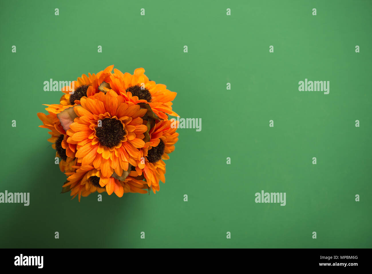 Reusable artificial flowers made from cloth and plastic. Stock Photo