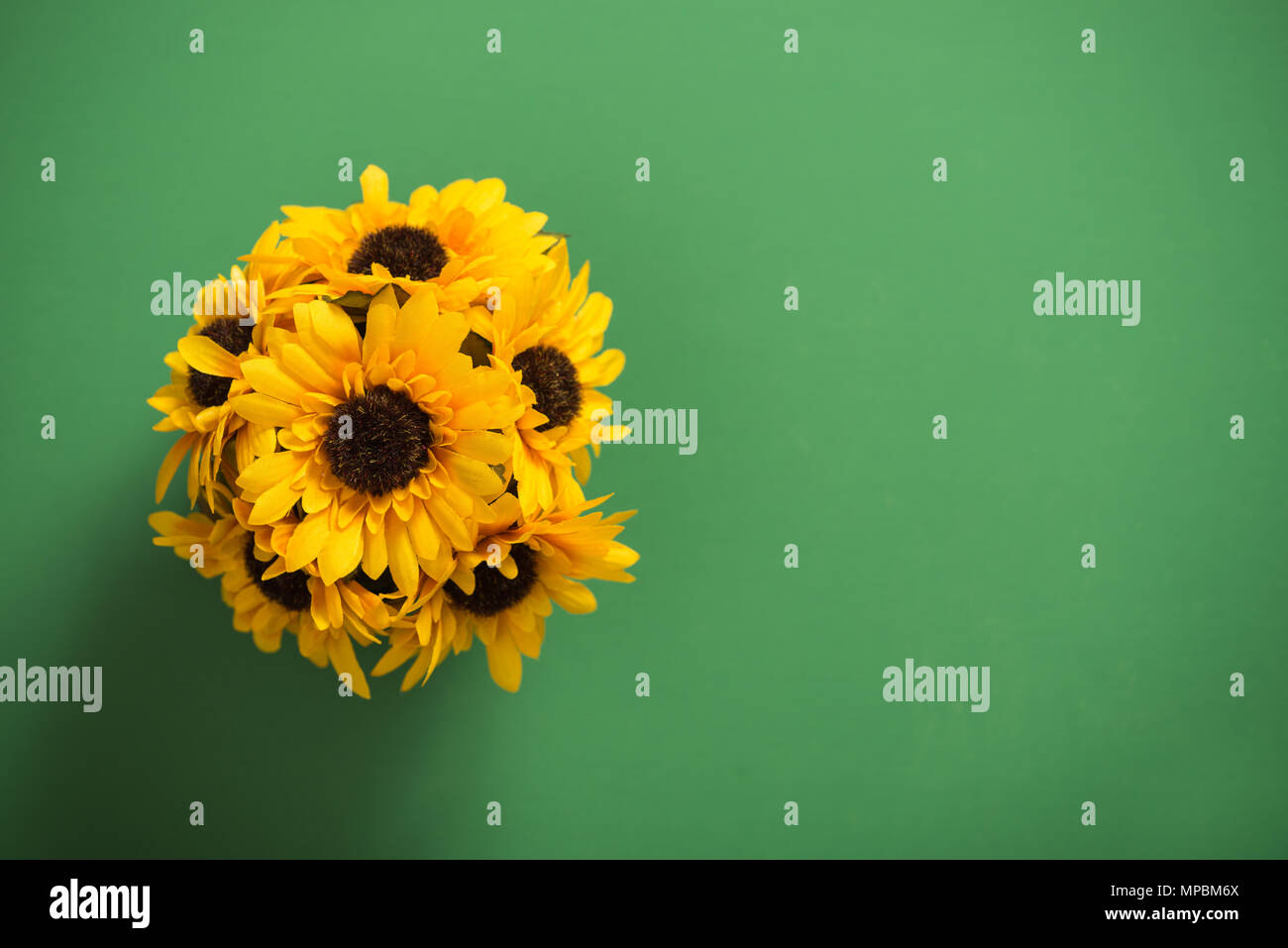 Reusable artificial flowers made from cloth and plastic. Stock Photo