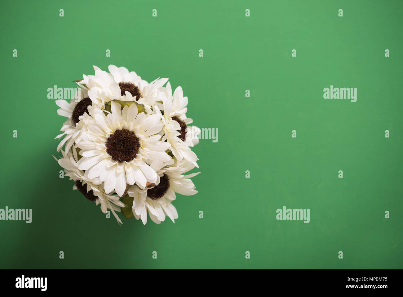 Reusable artificial flowers made from cloth and plastic. Stock Photo