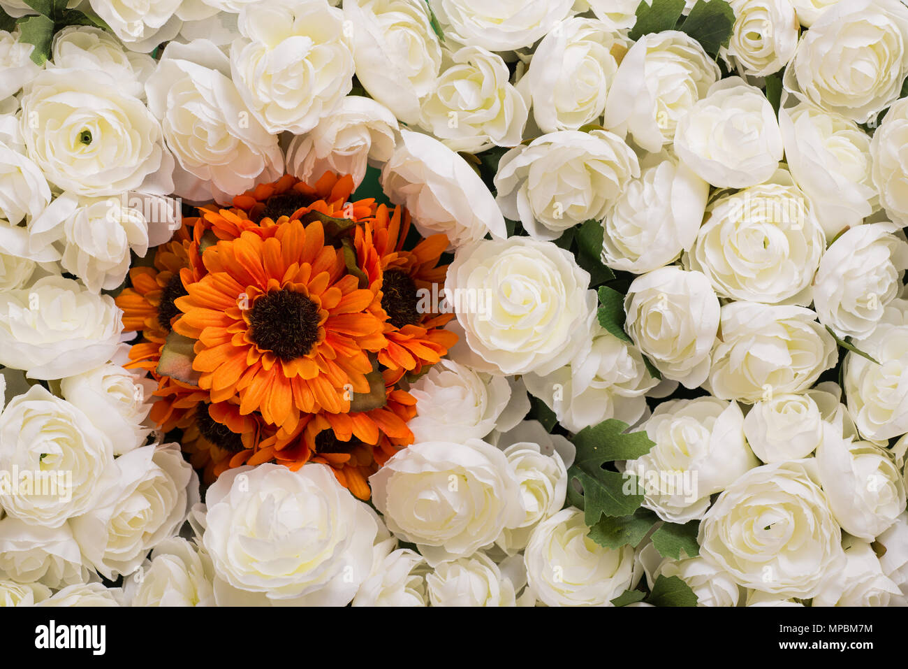 Reusable artificial flowers made from cloth and plastic. Stock Photo