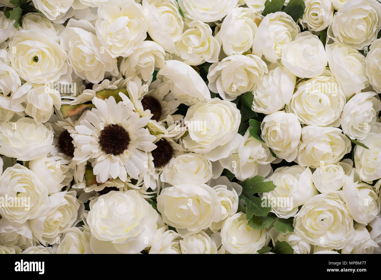 Reusable artificial flowers made from cloth and plastic. Stock Photo