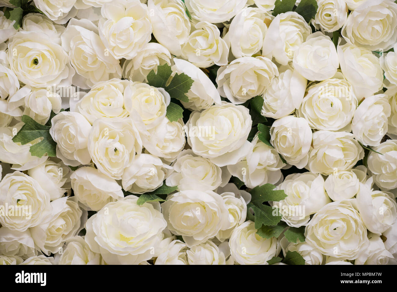 Reusable artificial flowers made from cloth and plastic. Stock Photo