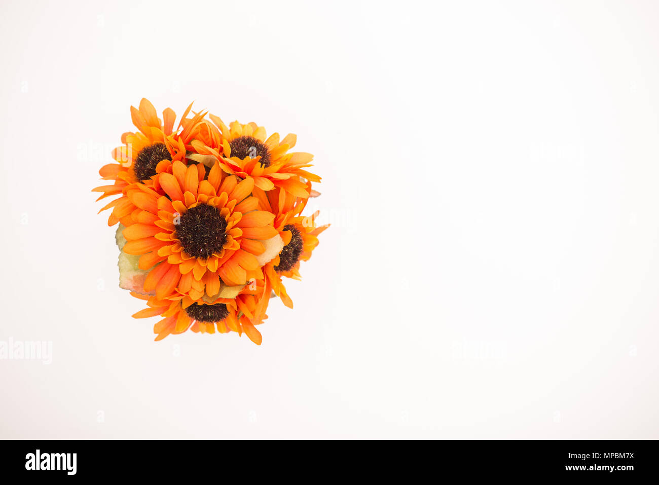 Reusable artificial flowers made from cloth and plastic. Stock Photo